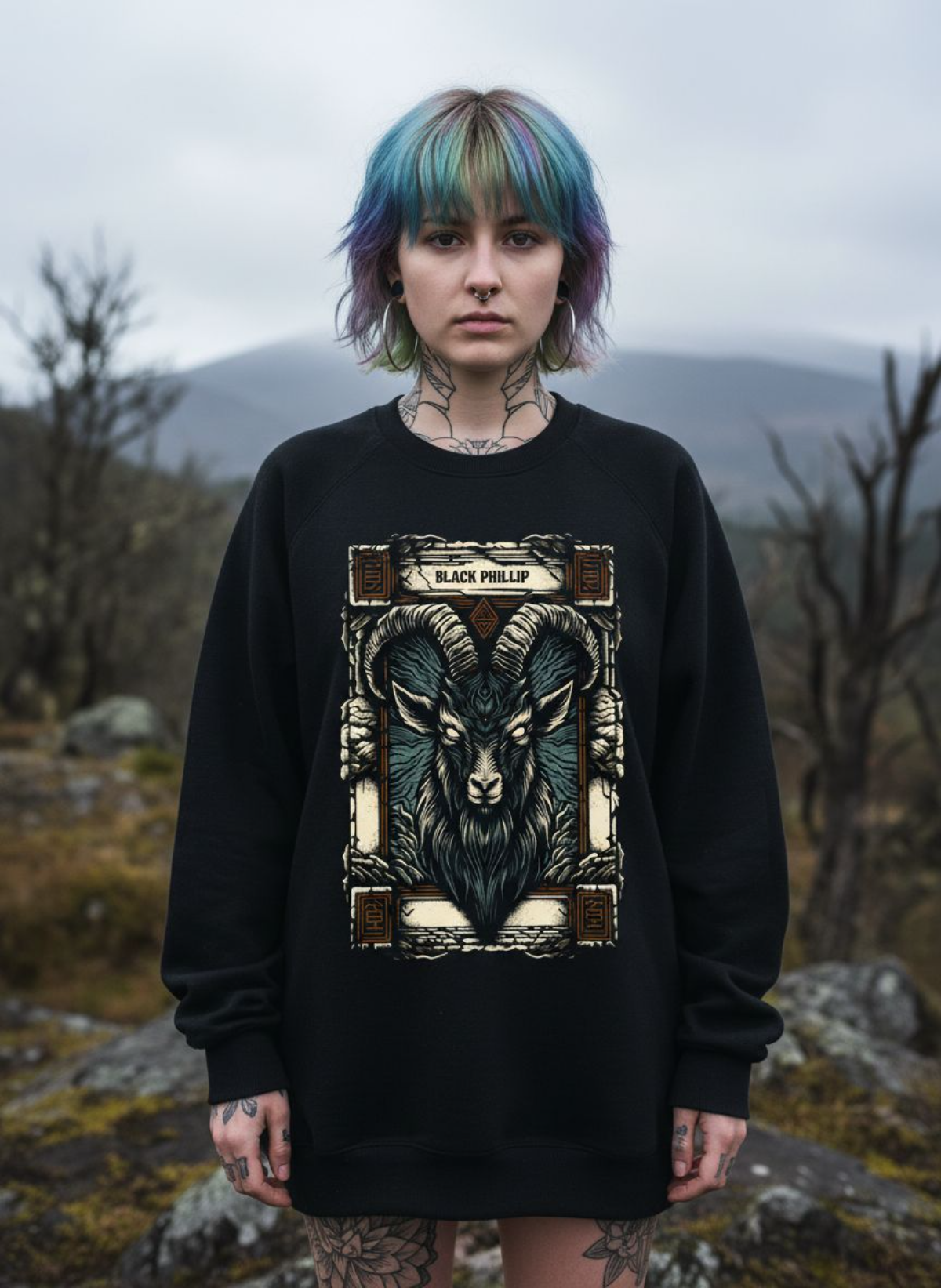 Person wearing a black sweatshirt with a goat design in a natural setting